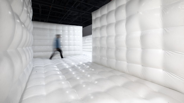 Inside the Rorschach asylum, a gigantic all-white jumping castle. 