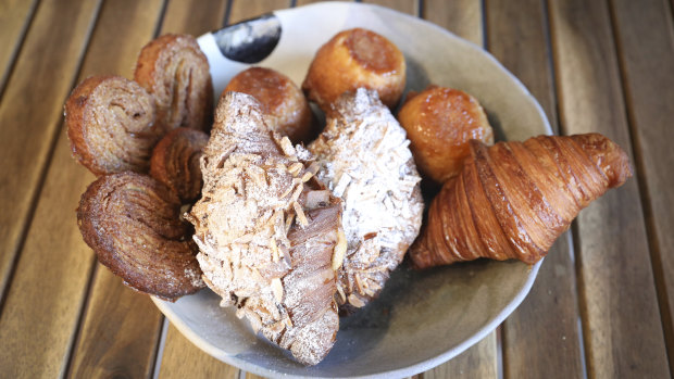 A selection of Flour Shop's pastries, including the almond croissant on top. 