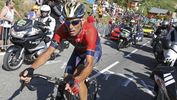 Forced to retire: Italy's Vincenzo Nibali climbs towards Alpe d'Huez after crashing during the 12th stage. His team is launching legal action against Tour organisers after he was unable to race on stage 13.