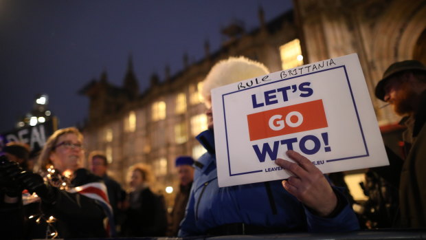 A pro-Brexit demonstrator holds a sign during the vote on a No-Deal Brexit outside Parliament on Wednesday.