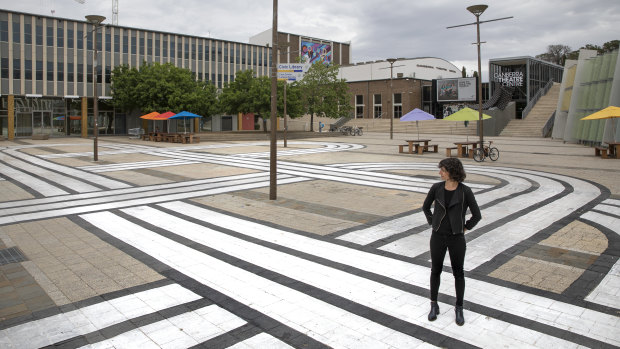 Marilou Chagnaud with her 'Play in a loop' graphic in Civic Square as part of the DESIGN Canberra festival. 