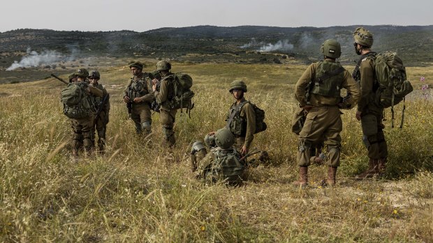 Israeli troops take part in a drill in northern Israel in May near the border with Lebanon. 