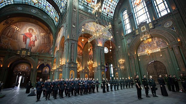Russian servicemen attend a service at the cathedral. 