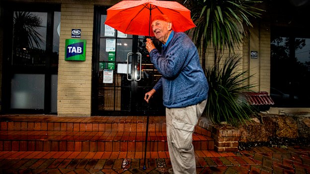 Mallacoota local Bill Embelton stands outside the Mallacoota Pub and TAB.