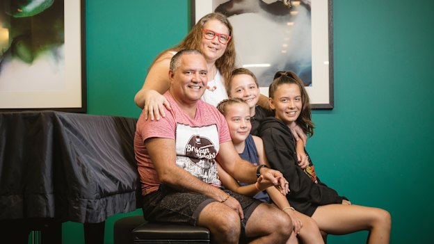 James and Fiona with three of their nine kids - Matilda, Eddie and Olivia.