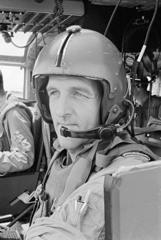 Flt Lt Frank Riley at the controls of his No.9 Squadron RAAF Iroquois helicopter, 1966.