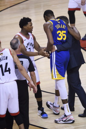 Kevin Durant is helped from the court.