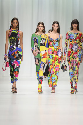 Models wear Versace’s Tribute Collection, printed with Vogue magazine covers and portraits of James Dean and Marilyn Monroe.