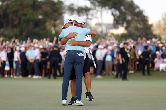 Caddie John Ellis embraces Wyndham Clark after he wins the 2023 US Open.