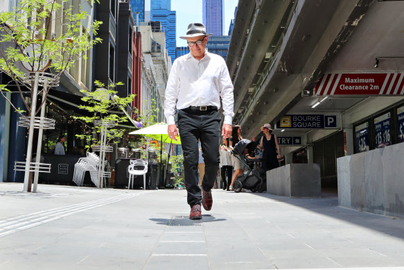 Victoria Walks executive officer Ben Rossiter navigates the bluestone tiles on Hardware Lane in Melbourne.