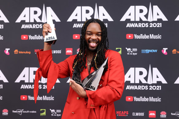 Genesis Owusu poses with his four ARIA Awards.