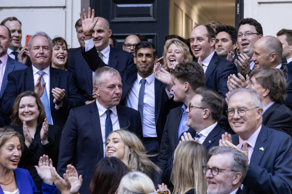 Incoming Prime Minister Rishi Sunak is greeted by colleagues at Conservative Party headquarters.
