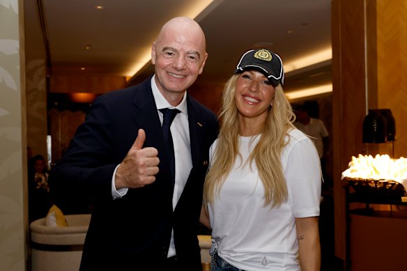 FIFA President Gianni Infantino poses with British singer Ellie Goulding during the Norway-England quarter-final.