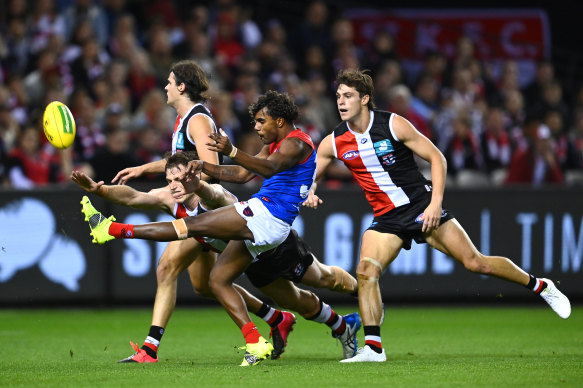 Kysaiah Pickett kicks for goal during a starring display for the Demons on Saturday night.