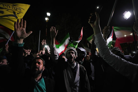 Iranian demonstrators chant slogans during an anti-Israeli gathering in front of the British Embassy in Tehran, Iran on Sunday.