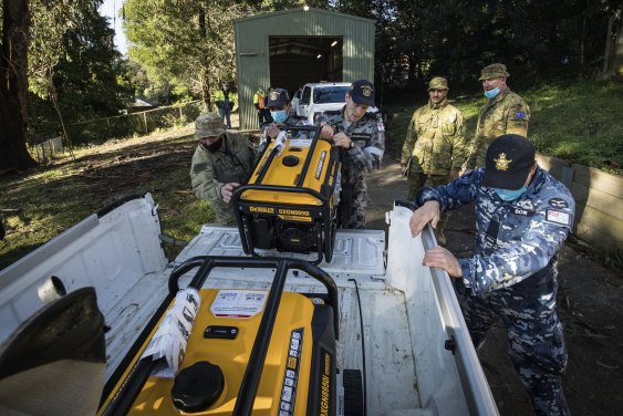 Troops prepare to distribute generators to residents in the storm-ravaged Dandenong Ranges.