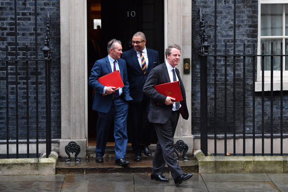 Leaving the first Cabinet meeting post-election are the government's Secretary of State for Wales, Simon Hart, the Conservative Party co-chairman, James Cleverly, and the Secretary of State for Scotland, Alister Jack.