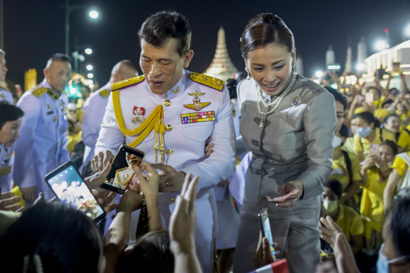 Thailand's King Maha Vajiralongkorn and Queen Suthida greet supporters last Sunday.