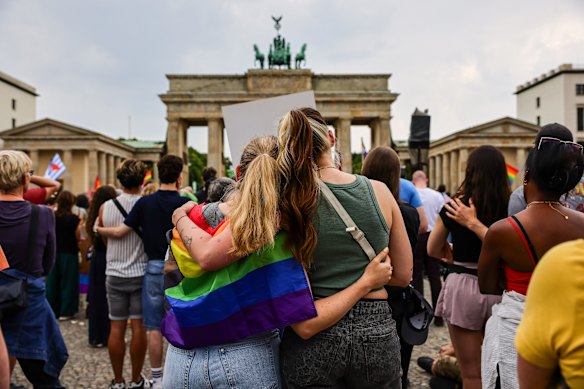People gather at Pariser Platz in front of the Brandenburg Gate in a memorial demonstration following the attack at Tiergarten park.