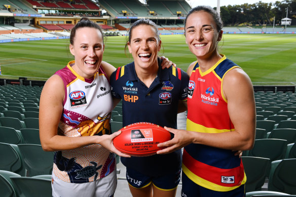 Brisbane Lions captain Emma Zielke with Adelaide’s Chelsea Randall, who will miss the grand final because of concussion, and stand-in Crows captain Angela Foley on Friday.