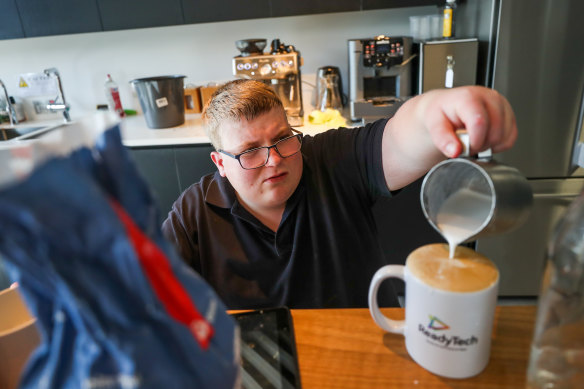 At your service: Kane Cross is the in-house barista in a Docklands office, in a new employment program for people with disability.