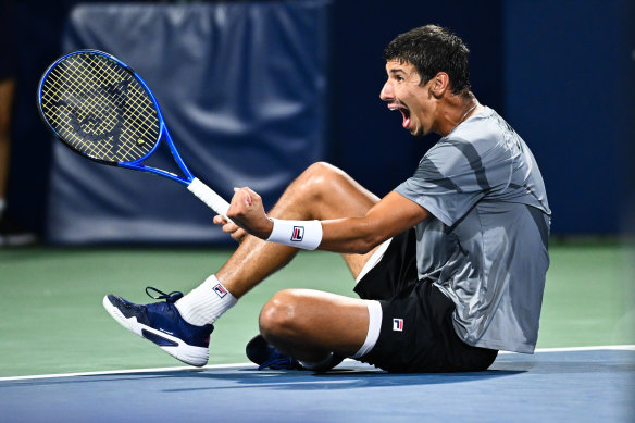 Popyrin falls to the ground in delight after clinching match point.