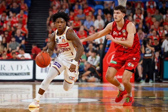 Kendric Davis of the Kings drives towards the hoop against the Wildcats.