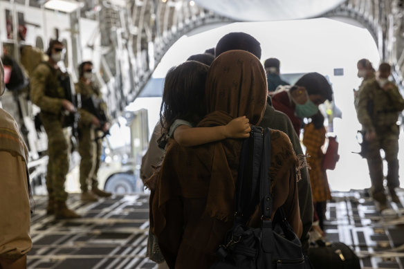 Afghanistan evacuees arrive at Australia’s main operating base in the Middle East, on board a Royal Australian Air Force C-17A Globemaster.