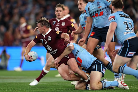 Harry Grant offloads the ball. 