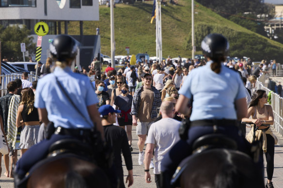 Mounted police patrol at Bondi Beach as part of public health order compliance operations on Sunday. 
