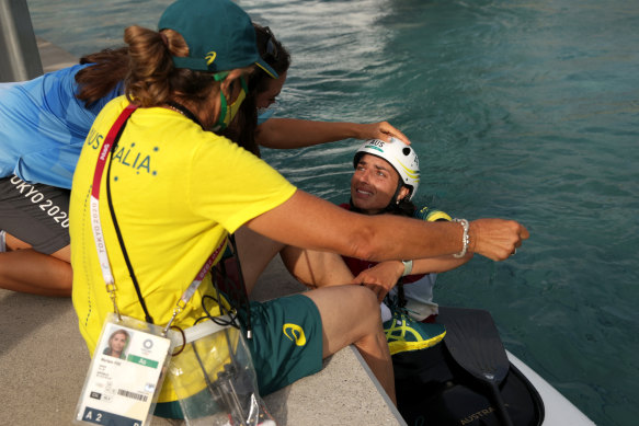 Jessica Fox celebrates with her team after winning gold.