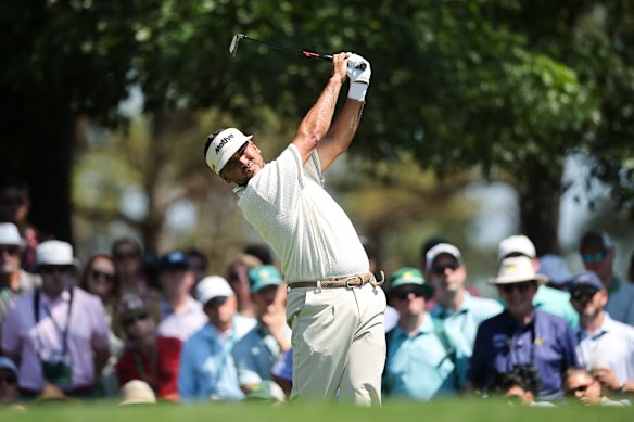 Jason Day of Australia plays his shot from the fourth tee.