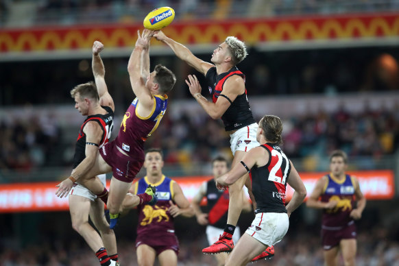 Matt Guelfi of the Bombers flies high to spoil a mark.