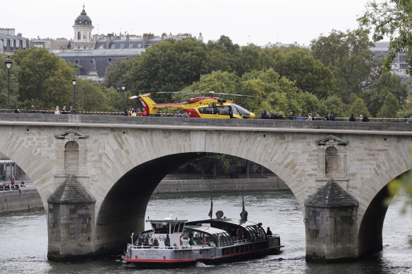 A helicopter is parked on the Pont Marie bridge after a stabbing at the police headquarters in Paris.