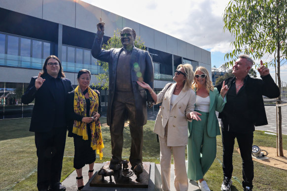 (L-R) Matt Gudinski, Jane Barnes, Sue Gudinski, Kate Gudinski and Jimmy Barnes pose for a photo at the unveiling of a statue of the late Michael Gudinski AM outside Rod Laver Arena.