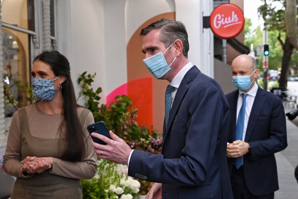 NSW Premier Dominic Perrottet and Treasurer Matt Kean outside a Sydney florist on Tuesday. 
