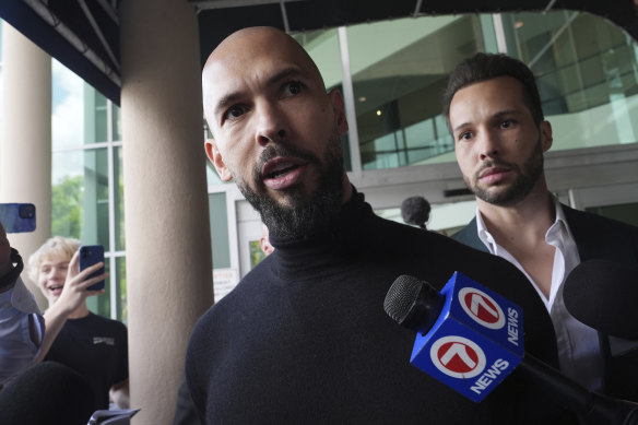 Andrew (front) and Tristan Tate arrive in Fort Lauderdale, Florida on Thursday, after Romanian authorities lifted the brothers’ travel restrictions.