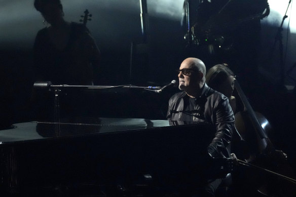 Billy Joel performs Turn The Lights Back On during the 66th annual Grammy Awards.