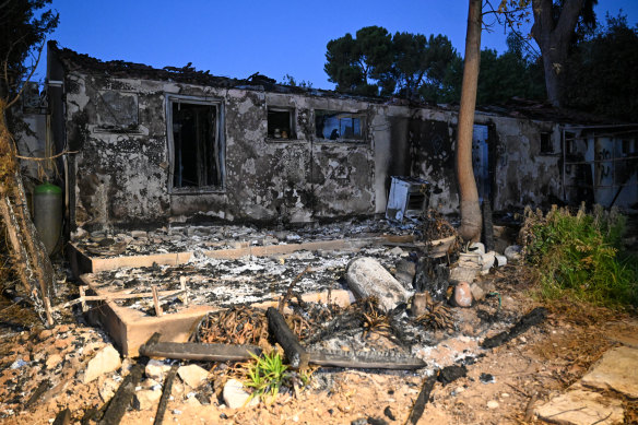 A house is destroyed after being burnt by Hamas militants during the attack at Kibbutz Be’eri, near the border with Gaza.