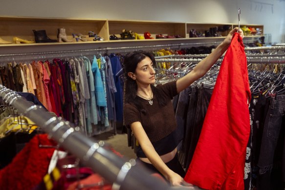 Angela goes through rare and vintage clothing items at SWOP, a consignment store in Newtown.