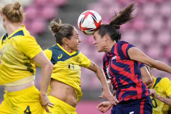 Australia’s Kyah Simon and Kelley O’Hara of the US in an aerial battle at the Tokyo Olympics.