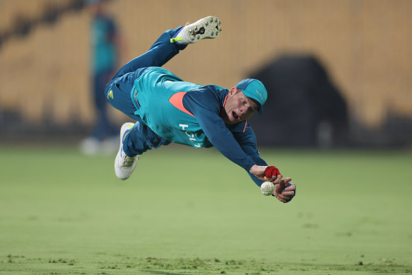 Steve Smith dives for a catch at training.