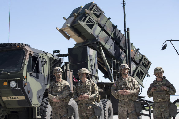 Members of US 10th Army Air and Missile Defence Command stands next to a Patriot surface-to-air missile battery in Lithuania in 2017.