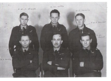 Four of the crew on the downed bomber. Don Wills (centre rear), Tony Hundy (front left), Keith Tanner (centre front, RAF pilot) and Ronald Dent (front right).