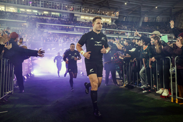 Sam Cane runs out before the start of the match. 