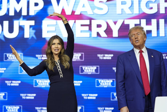 Donald Trump watches as South Dakota Governor Kristi Noem dances to YMCA in Philadelphia last month.