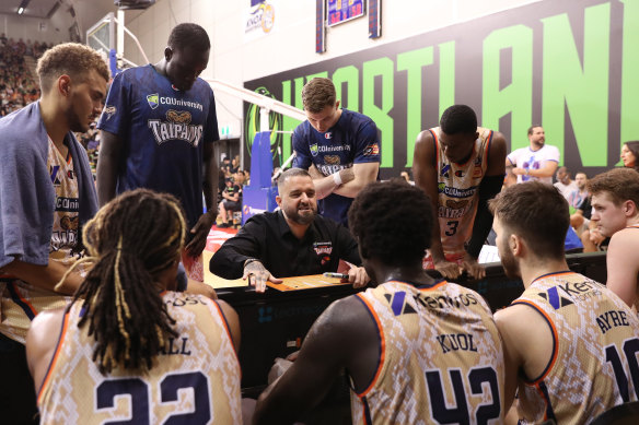 Taipans players are addressed by their coach during a game on Wednesday.