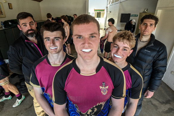 Haileybury rugby players Lucas Civitarese (second from left), Charlie Bell and Joe Nelson with their coach Aidan Ryan (left) and researcher Spencer Roberts.