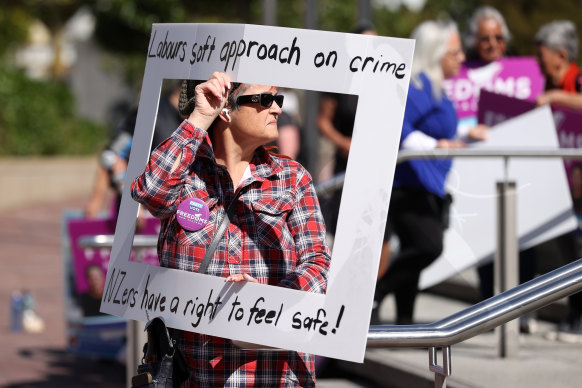 Protesters gather outside as Prime Minister Chris Hipkins arrives to launch Labour’s election campaign in Auckland on Saturday.