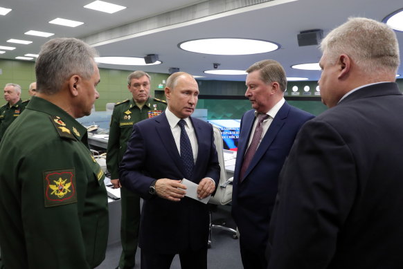 Russian President Vladimir Putin (centre) watches a test flight of the Avangard hypersonic system in 2018.